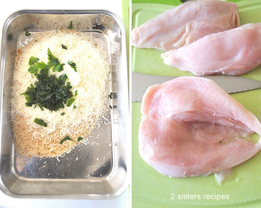 A silver tray with bread crumbs mixture, and a cutting board with chicken breasts, and one slice in half. by 2sistersrecipes,com