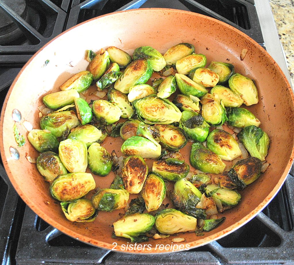 Sauteed Brussels Sprouts in a Skillet on Stovetop. by 2sistersrecipes.com