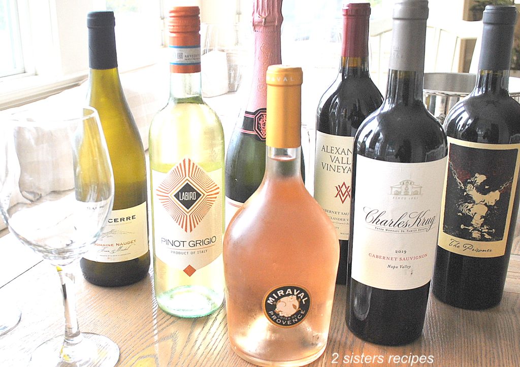Bottles of Wines and Proseccos are displayed on the table.