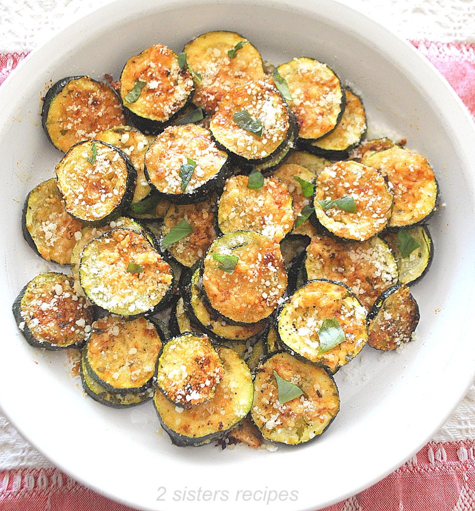 Roasted Parmesan Zucchini served in a round white plate.