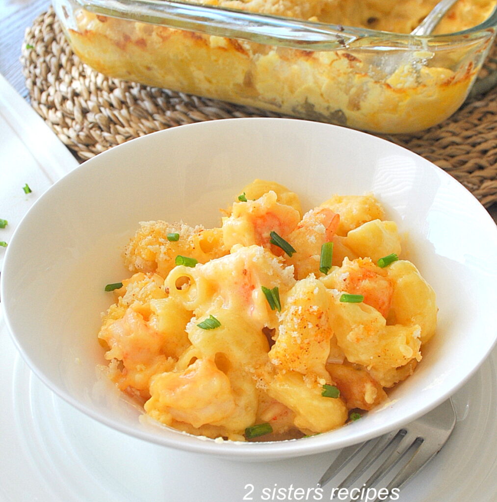 A white bowl of shrimp mac and cheese.