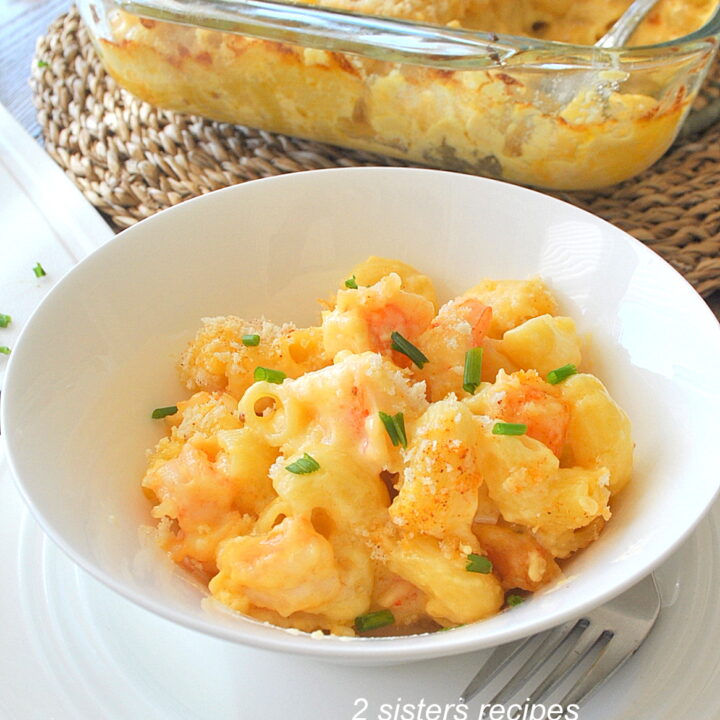 A white bowl of shrimp mac and cheese.