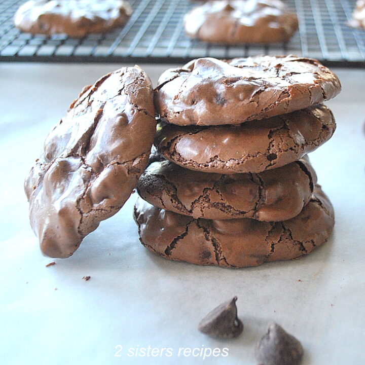 A pile of chocolate cookies set on the table.