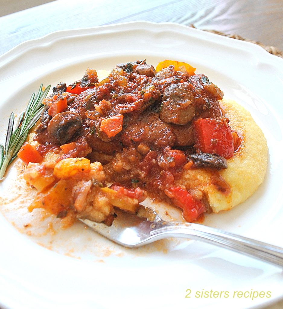 A forkful of polenta, vegetables and chicken cacciatore. by 2sistersrecipes.com