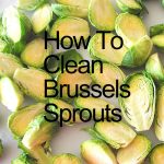 A white board filled with clean and prepped Brussels Sprouts.