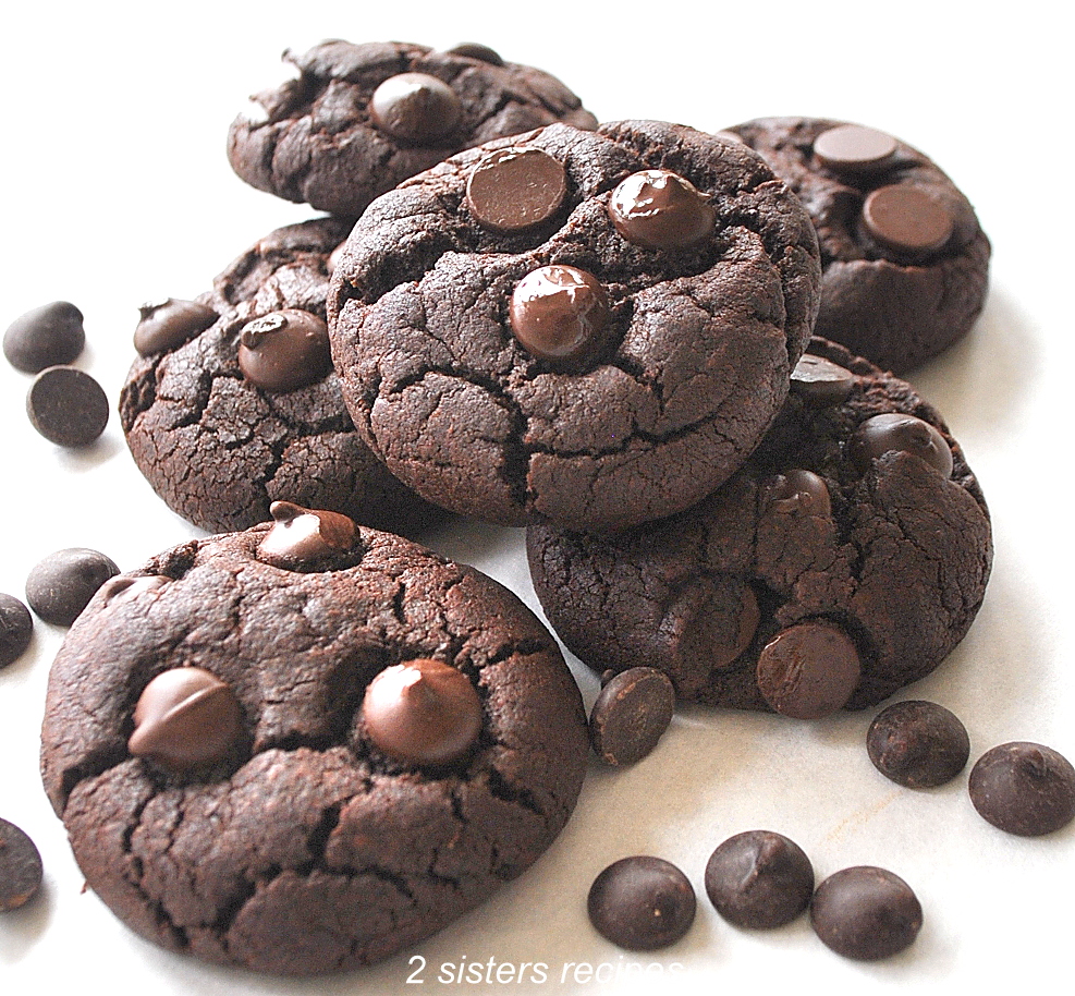 A few brownie cookies on a white board. by 2sistersrecipes.com