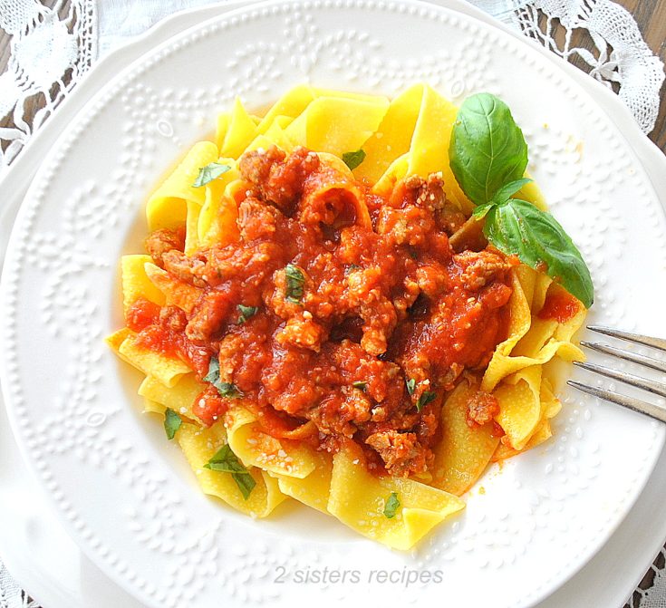 A bowl of pappardelle pasta served with pork ragu. by 2sistersrecipes.com