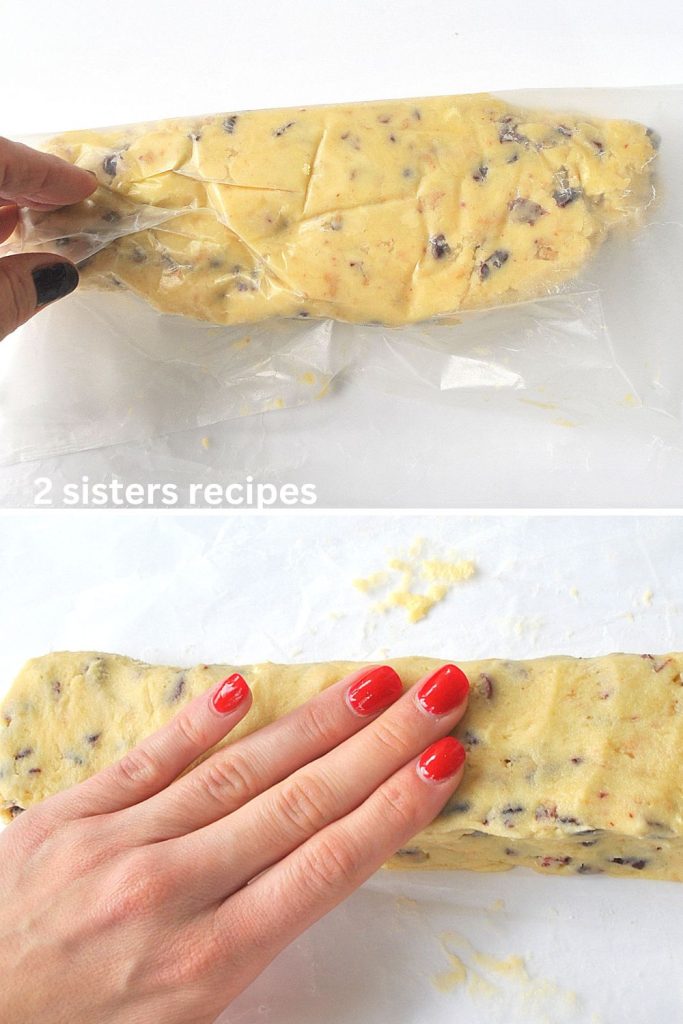 The cookie dough  is placed on wax paper, and shaped into a square log. by 2sistersrecipes.com