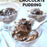 Three dessert glasses filled with dairy-free chocolate pudding, topped with mini chocolate chips and grated chocolate.