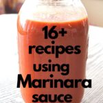 A mason jar filled with fresh marinara sauce set on a table.