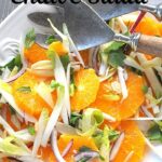 A white platter filled with a sliced orange and endive salad.