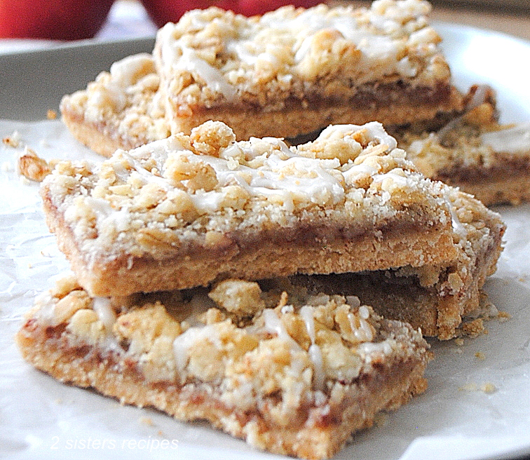 A few bars piled on top of each other served on white parchment paper.