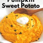 A white bowl filled with mashed pumpkin puree with sweet potatoes, topped with a small dollop of sour cream.