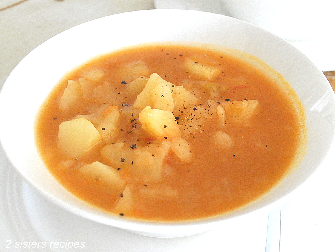 A white bowl filled with mom's potato soup.