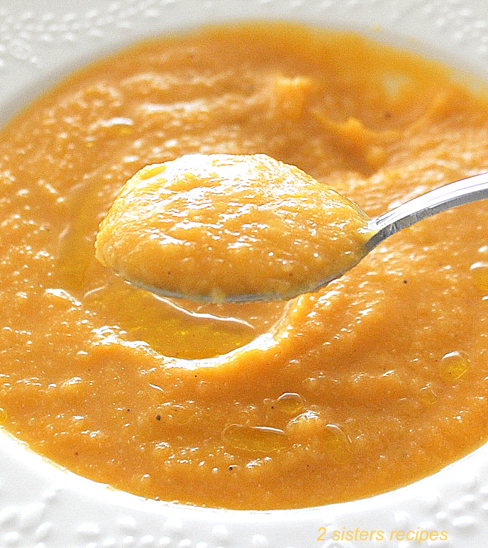 A spoonful of creamy sweet potato cauliflower soup.