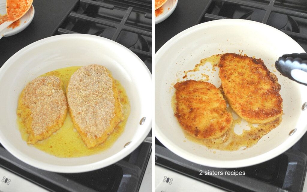 A skillet with shallow oil, frying 2 chicken cutlets until golden.