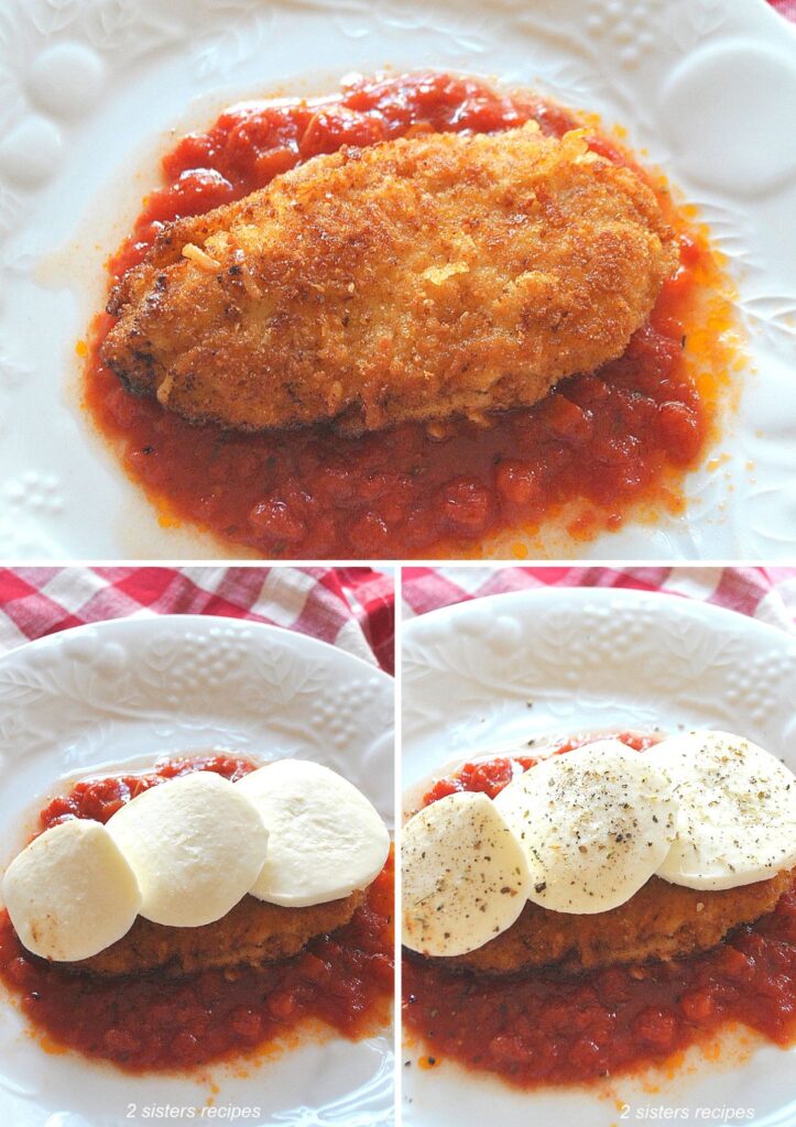 White dinner plate with a layer of tomato sauce, chicken cutlet set on top, and topped with slices of mozzarella.