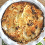 A pie baking dish with a cabbage gratin fully baked.