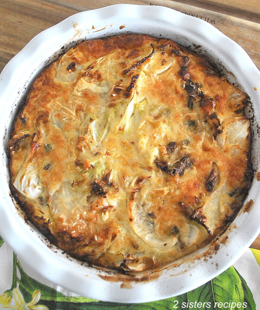 A pie baking dish with a cabbage gratin fully baked.