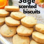 A white platter filled with round shortbread cookies called orange sage biscuits.