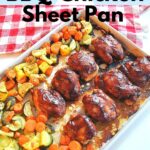 A large sheet pan filled with baked barbecue chicken thighs and mixture of veggies.