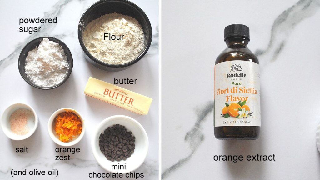 Ingredients are displayed in small bowl set on the counter. And a bottle of orange extract.