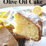 A slice of lemon cake with icing on top.