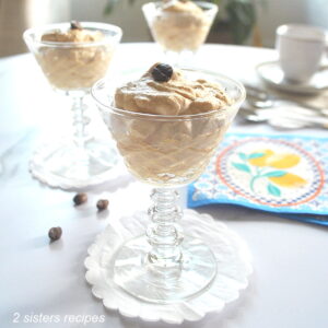 Three stem glasses filled with a coffee cream.