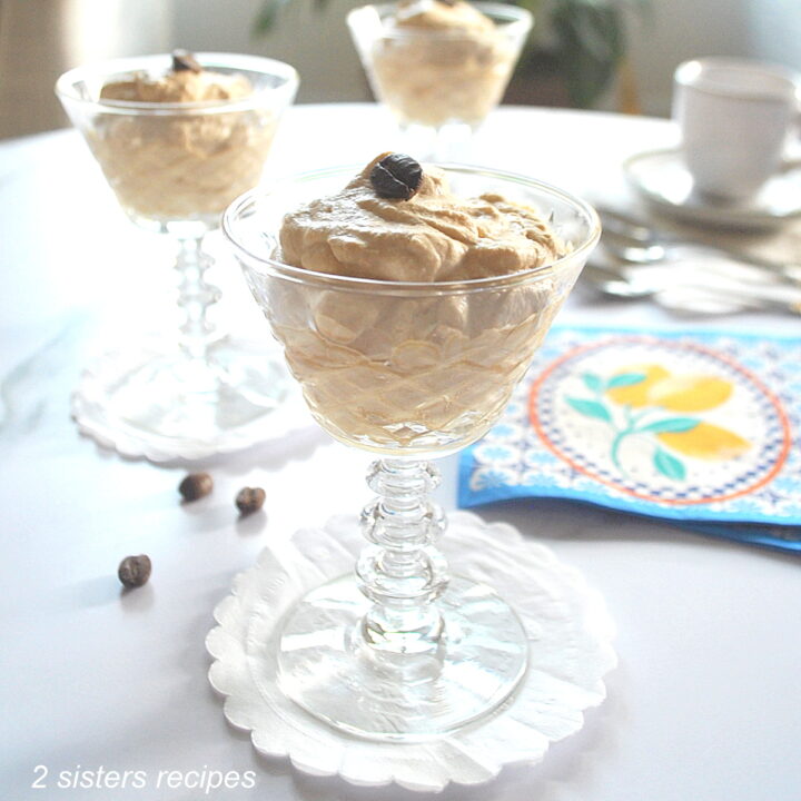 Three stem glasses filled with a coffee cream.
