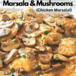 A white platter filled with chicken cooked with Marsala wine and mushrooms.