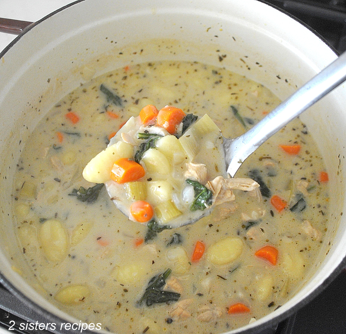Chicken Gnocchi Soup A large pot filled with a creamy soup loaded with pieces of