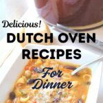A Dutch Oven set on the table with a white bowl of soup.