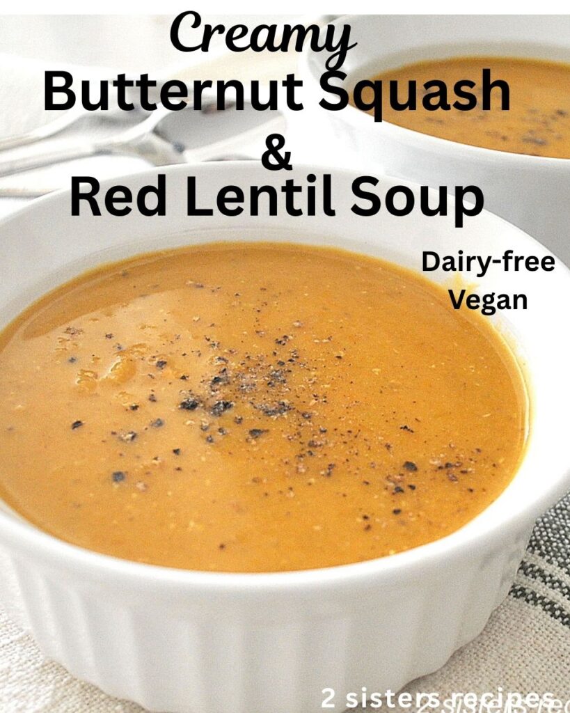 A white bowl filled with pureed soup of butternut and red lentil soup.