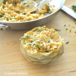 one artichoke bottom stuffed with a bread crumb and cheese mixture.