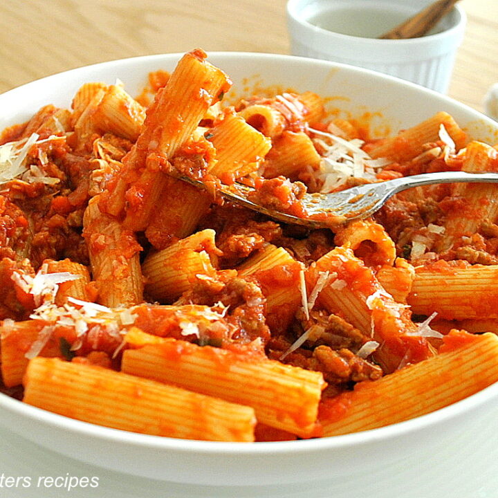 A forkful of rigatoni pasta with Lamb Bolognese.