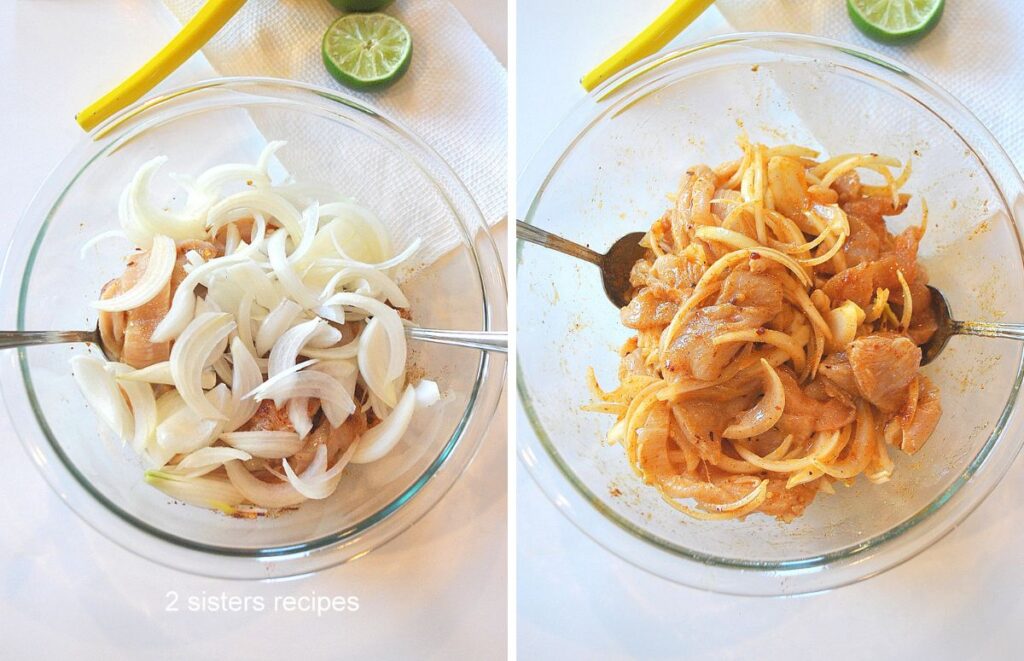 A glass bowl filled with mixture of chicken with sliced onions on top, them tossed to mix.