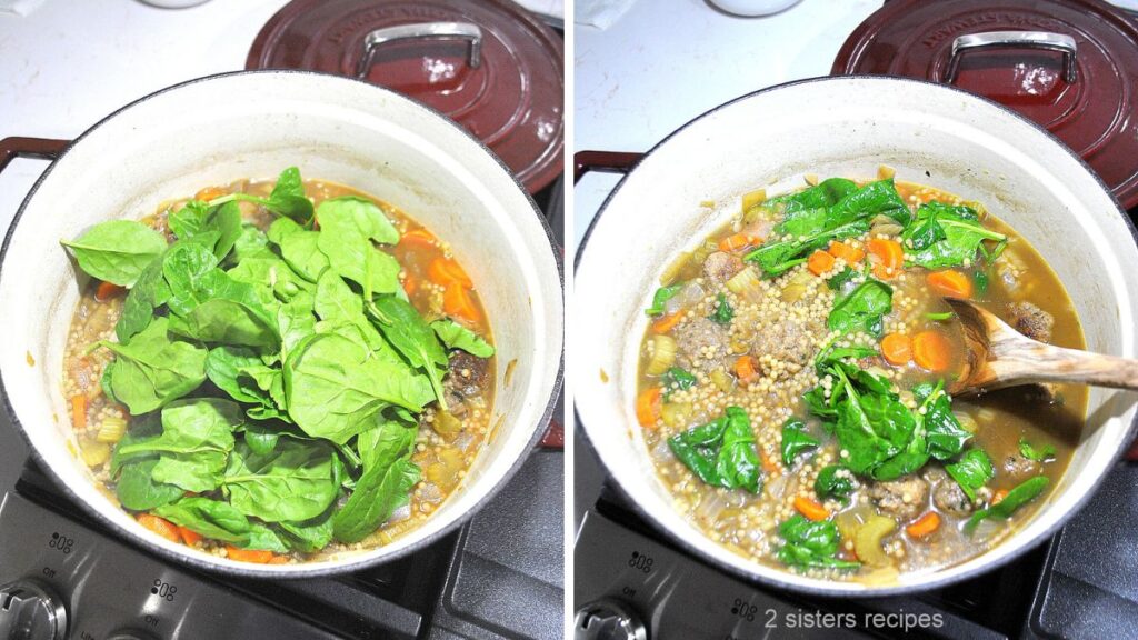 A Dutch oven filled with soup, fresh spinach on top.