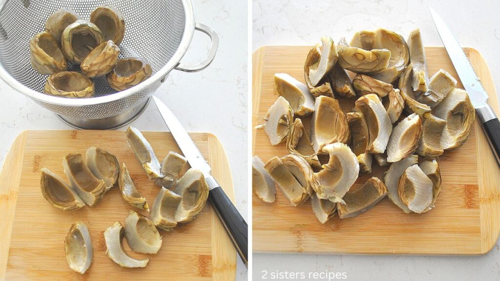 A colander filled with artichoke bottoms, and cutting board with them sliced.