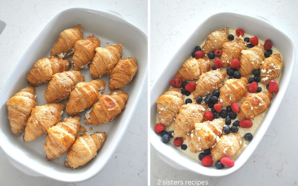 A white baking dish filled with croissants and custard poured around it and berries scattered on top .