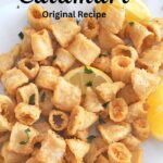 Crispy fried calamari served with lemon wedges.