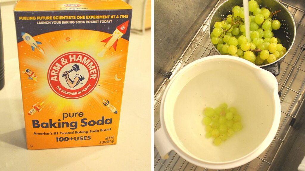 A white bowl filled with water, and a colander with grapes in the sink. 