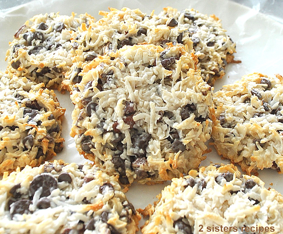 On a platter are baked coconut pecan chocolate chips cookies displayed. 