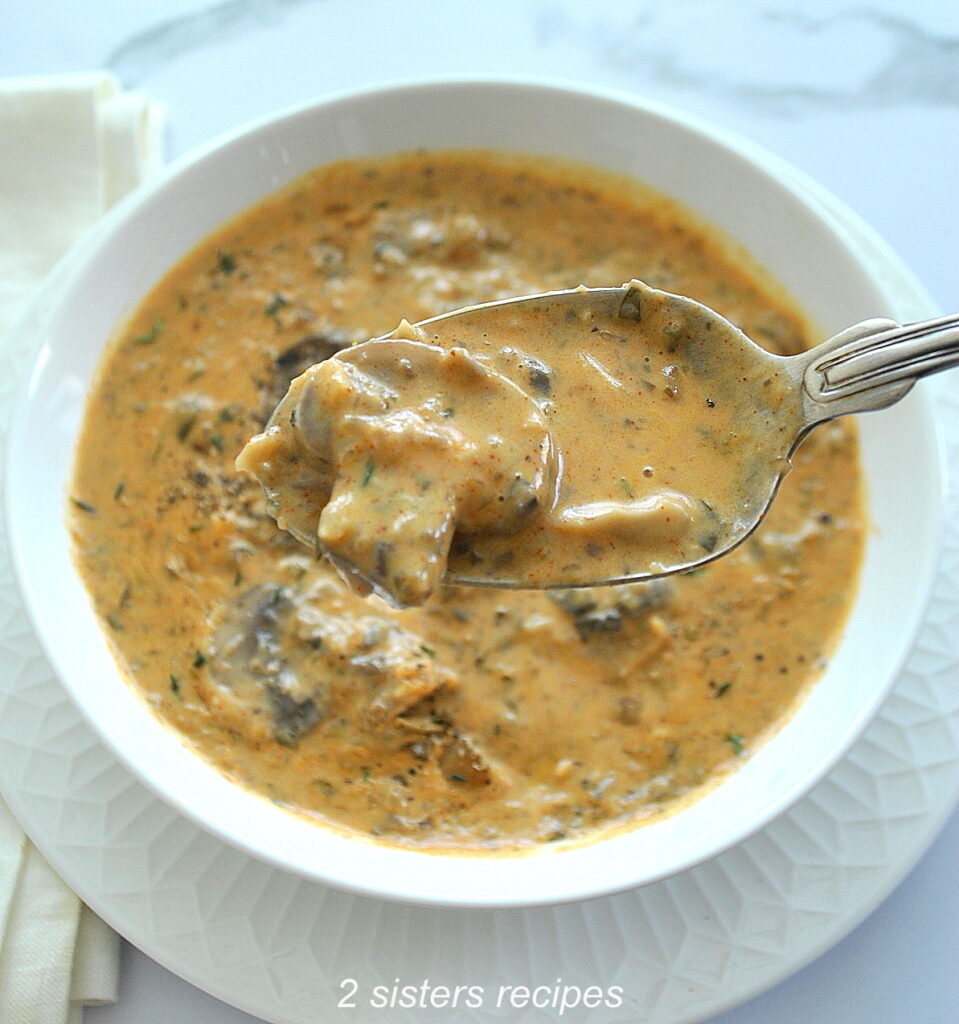 A spoonful of creamy mushroom soup. 