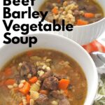 two white bowls of beef barley vegetable soup.