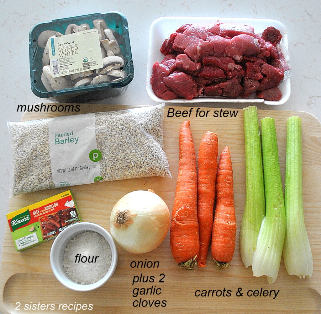 Fresh carrots, celery, onion, mushrooms, a package of pearled barley, and package of chunks of beef. 