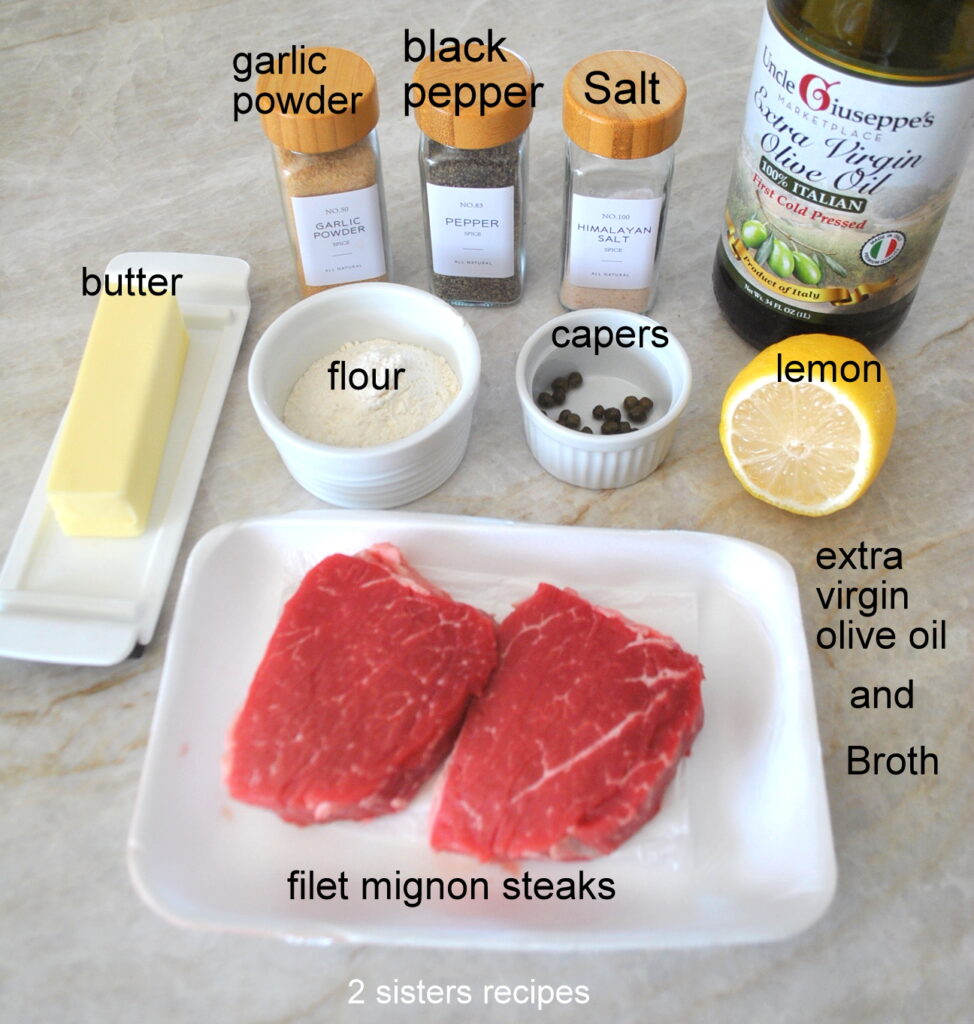 2 small filet mignons, butter, plus bottles of seasonings and olive oil, along with flour, capers and lemon.