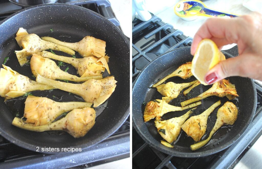 A black skillet with long stem marinated artichokes searing until golden brown.